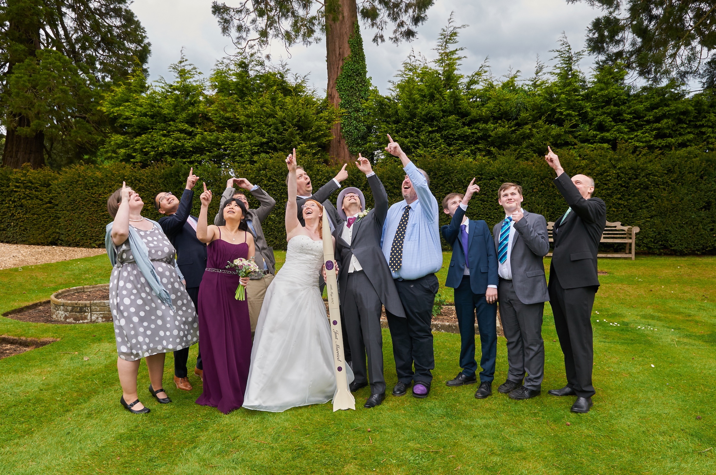Rocketry Wedding guests being silly pointing at a pretend rocket in the sky